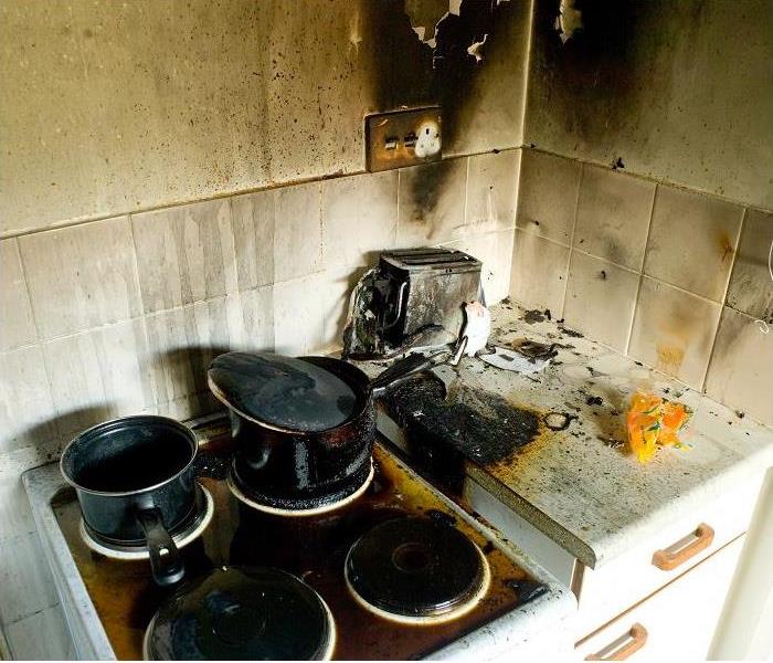 fire damaged stove; burned backsplash